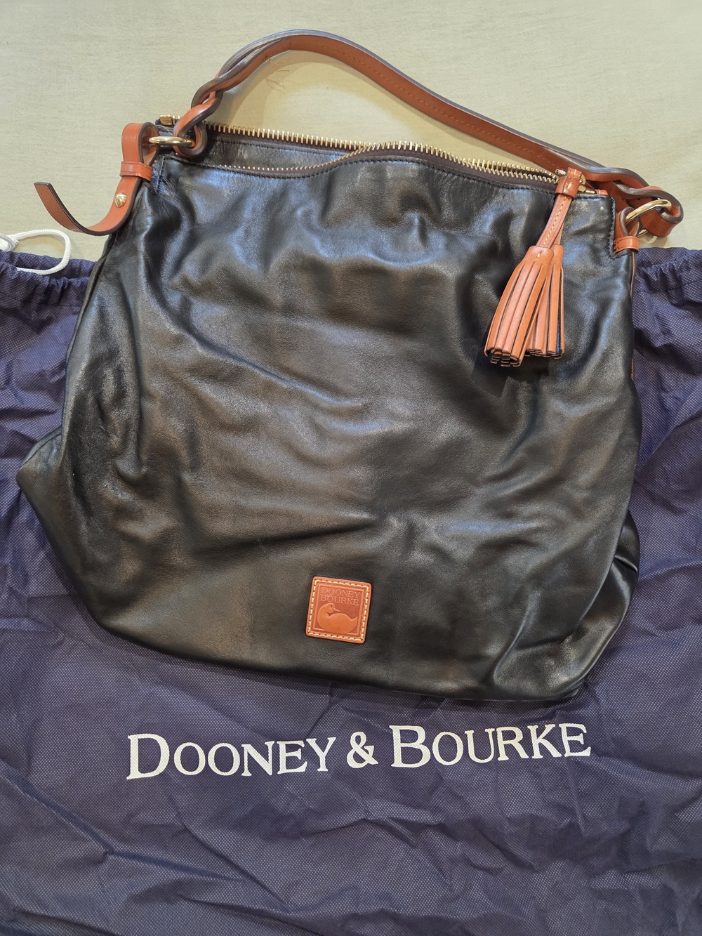 Dooney & Bourke Black Leather Shoulder Hobo with Tan Trim and Tassel